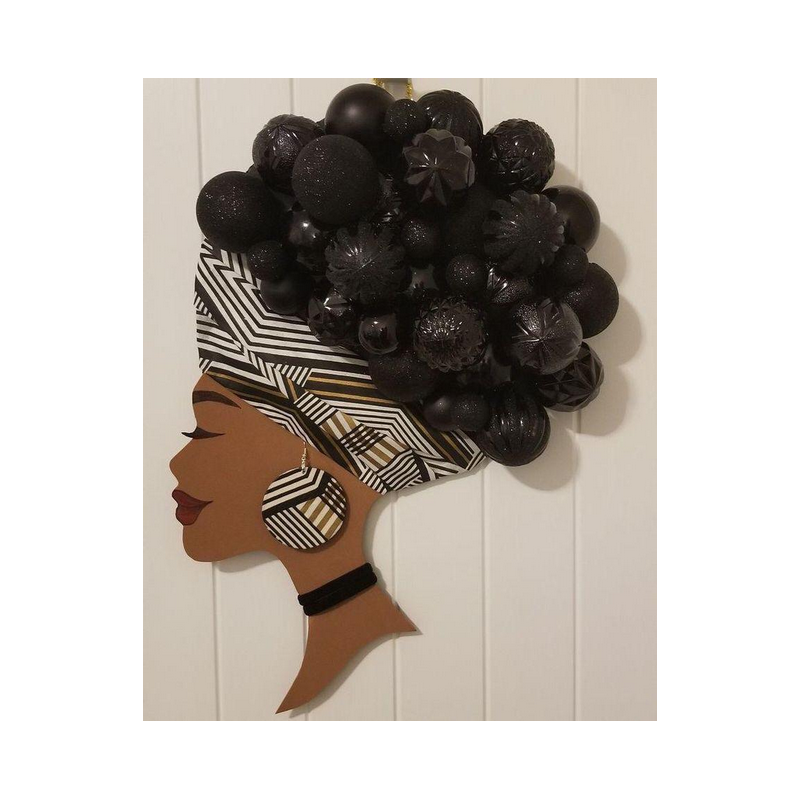 Décoration d4 Artmurale en silhouette de profil d'une femme africaine avec une coiffure artistique